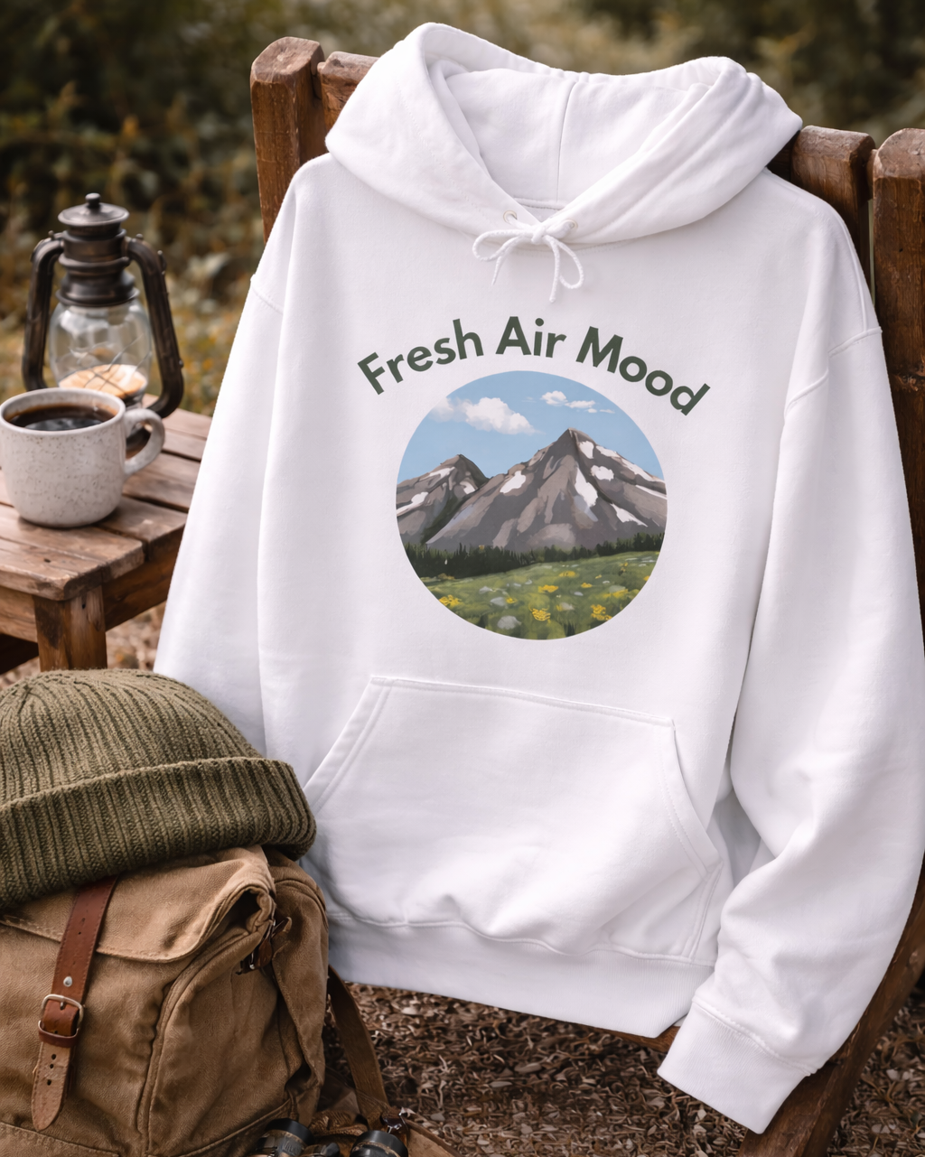 Weißer oder aschgrauer Unisex Hoodie mit dem Schriftzug „Fresh Air Mood“ und Berglandschaft-Motiv für Wanderer, Naturliebhaber und Outdoor-Fans.
