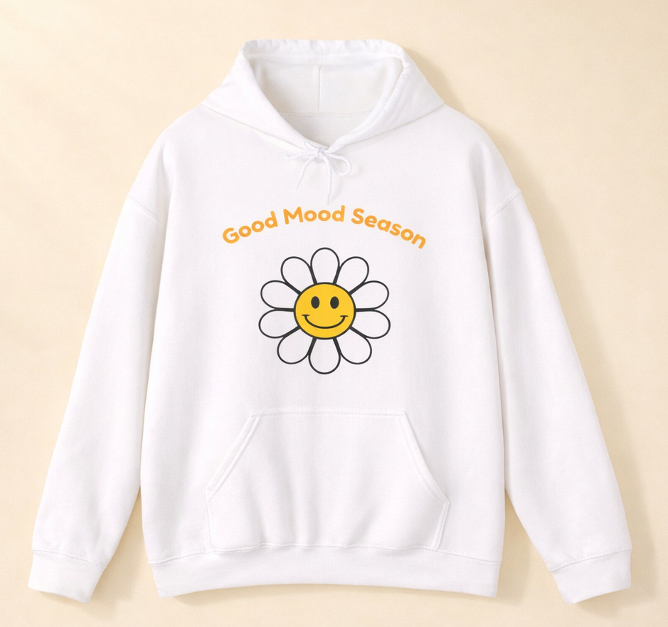 Weißer Unisex-Hoodie mit gelbem Smiley-Blumenmotiv und dem Schriftzug „Good Mood Season“ auf der Vorderseite.