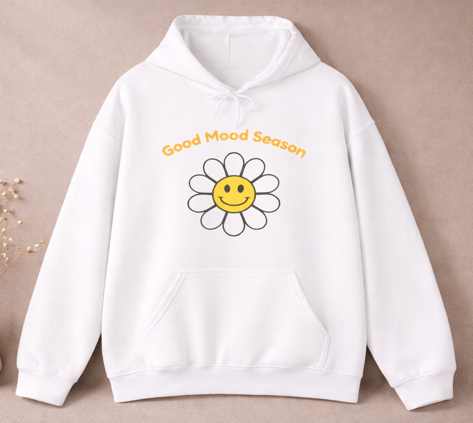 Weißer Unisex-Hoodie mit gelbem Smiley-Blumenmotiv und dem Schriftzug „Good Mood Season“ auf der Vorderseite.