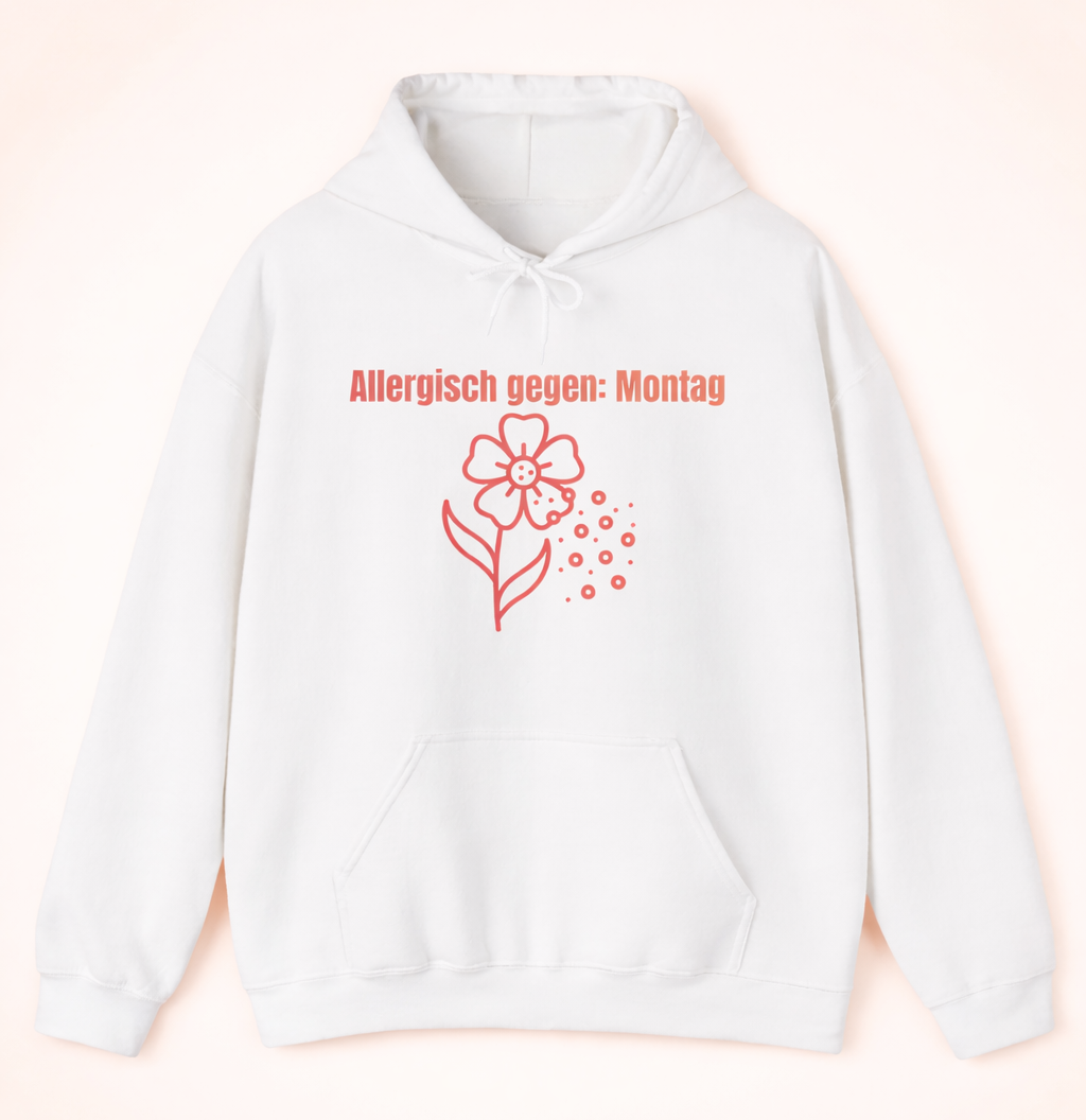 Weißer Unisex-Hoodie mit dem Spruch „Allergisch gegen Montag“ und humorvollem Blumenmotiv mit fliegenden Pollen auf der Vorderseite.