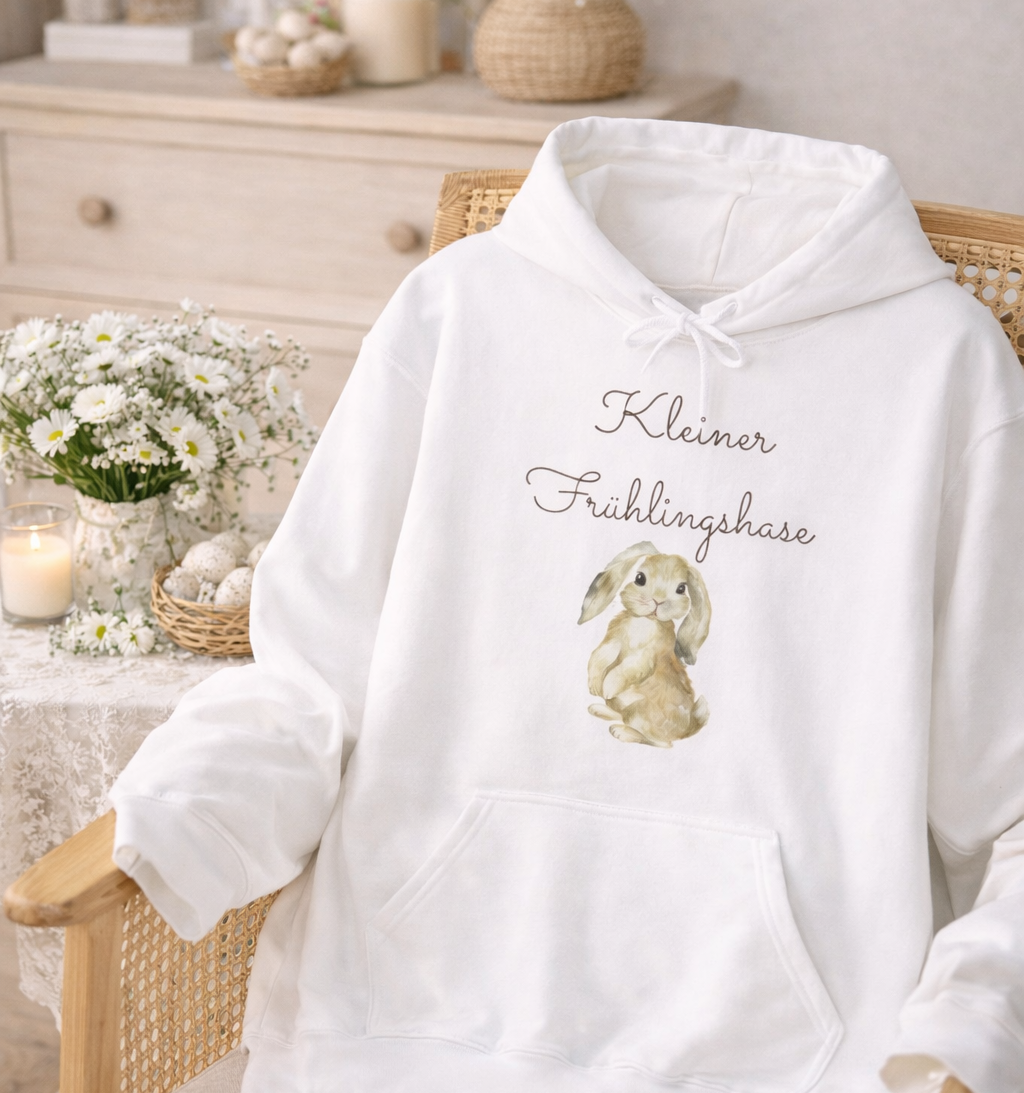 Weißer Unisex-Hoodie mit süßem Hasenmotiv und dem Schriftzug „Kleiner Frühlingshase“ auf der Vorderseite.