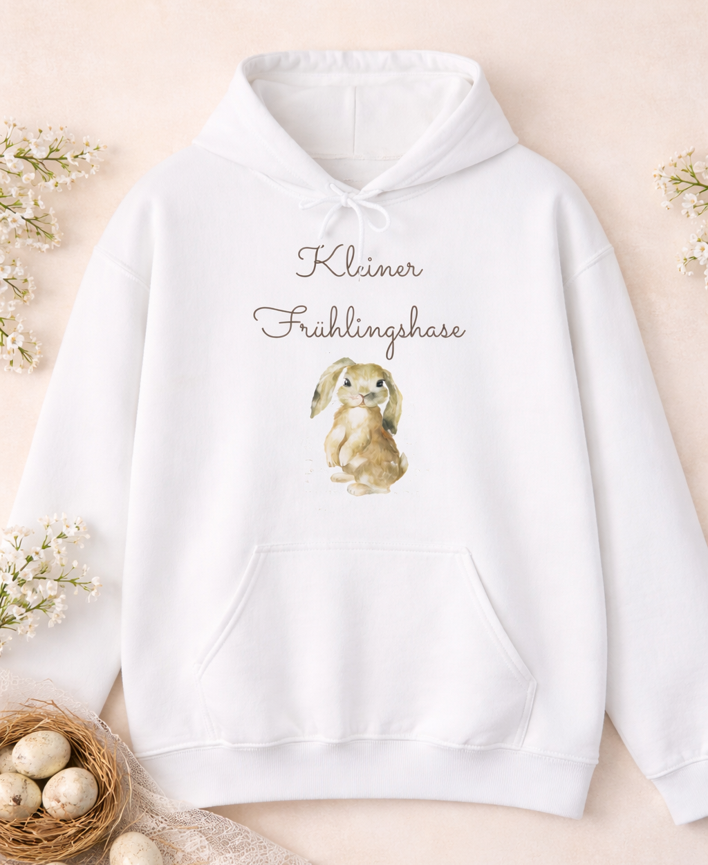 Weißer Unisex-Hoodie mit süßem Hasenmotiv und dem Schriftzug „Kleiner Frühlingshase“ auf der Vorderseite.