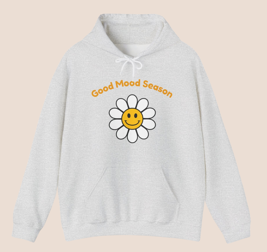 Weißer Unisex-Hoodie mit gelbem Smiley-Blumenmotiv und dem Schriftzug „Good Mood Season“ auf der Vorderseite.