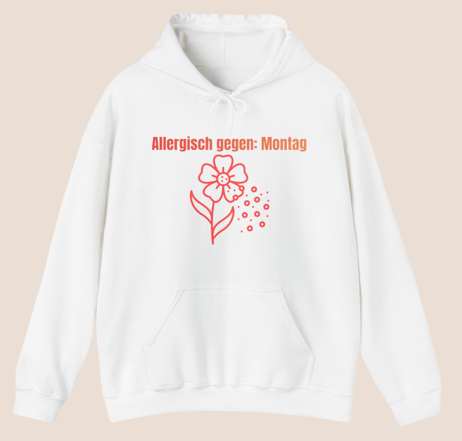 Weißer Unisex-Hoodie mit dem Spruch „Allergisch gegen Montag“ und humorvollem Blumenmotiv mit fliegenden Pollen auf der Vorderseite.