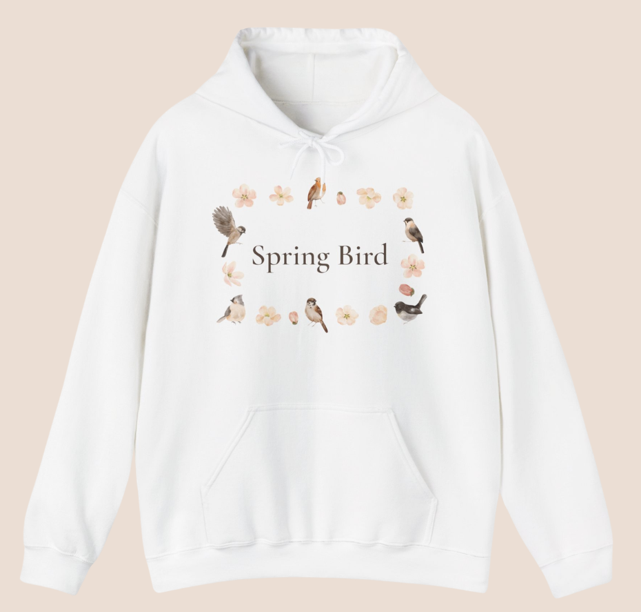 Weißer Unisex-Hoodie mit dem Schriftzug „Spring Bird“, umgeben von kleinen Vögeln und zarten Blütenmotiven in einem Frühlingskranz.