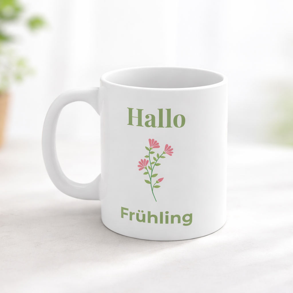 Weiße Keramiktasse mit dem Schriftzug „Hallo Frühling“ und einem zarten rosa Blumenmotiv – frühlingshafte 300-ml-Tasse für Kaffee oder Tee.