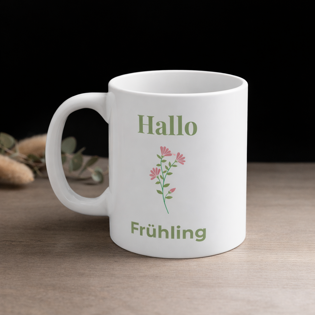 Weiße Keramiktasse mit dem Schriftzug „Hallo Frühling“ und einem zarten rosa Blumenmotiv – frühlingshafte 300-ml-Tasse für Kaffee oder Tee.