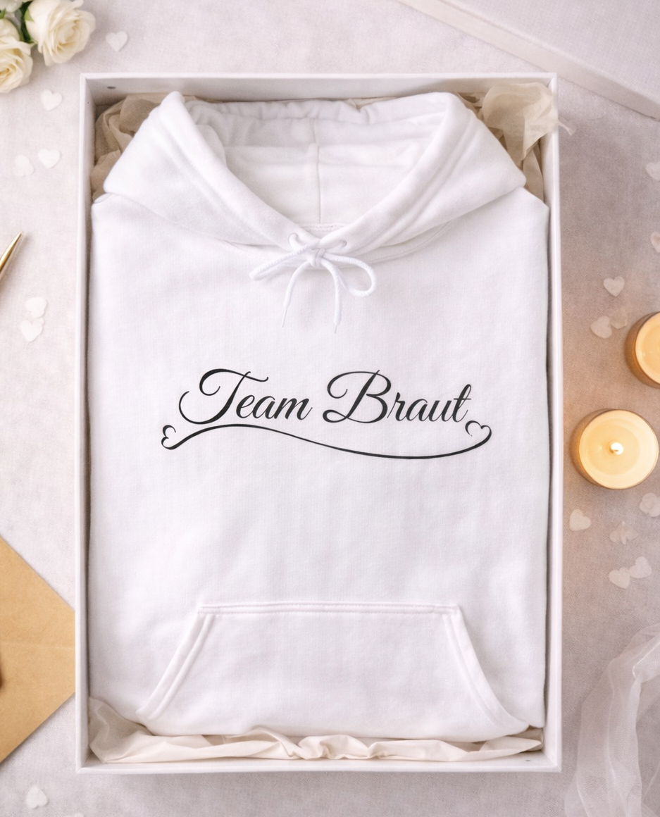 Weißer Unisex Hoodie mit elegantem Schriftzug „Team Braut“ und Herzdetail – ideal für Junggesellinnenabschied, Brautjungfern und Hochzeiten.