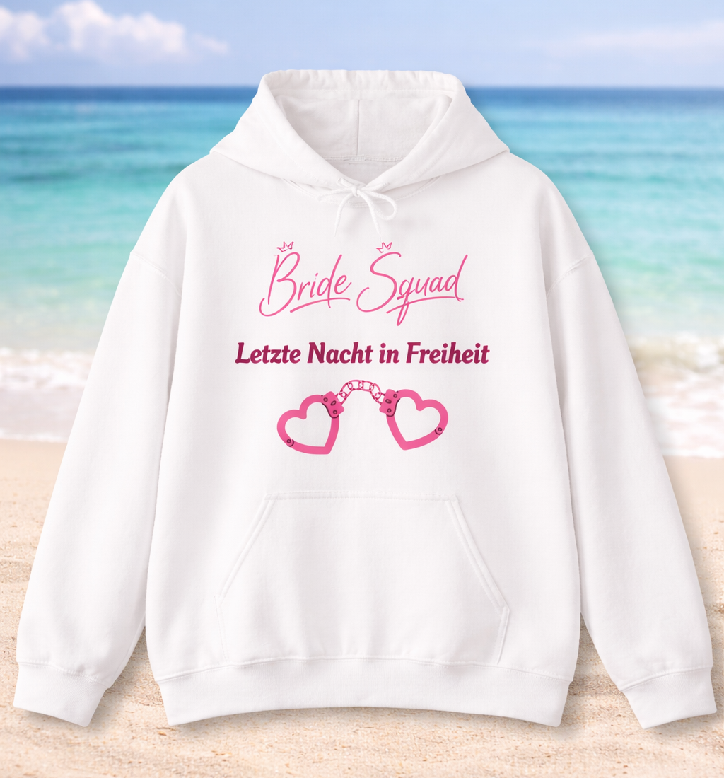 Weißer Unisex-Hoodie mit dem Schriftzug „Bride Squad – Letzte Nacht in Freiheit“ und rosa Herz-Handschellen als Motiv – ideal für den Junggesellinnenabschied.