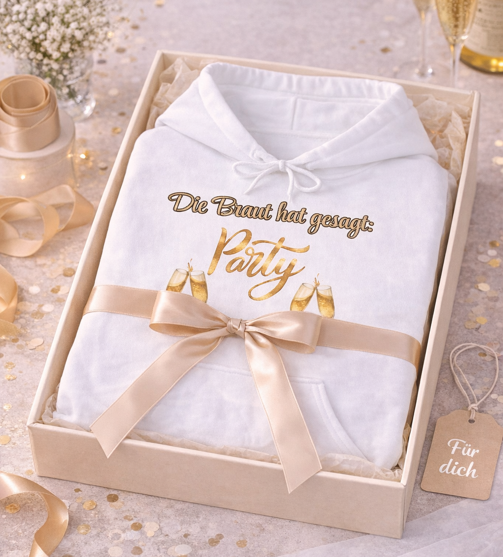 Weißer Unisex-Hoodie mit dem Spruch „Die Braut hat gesagt: Party“ sowie goldenen Champagnergläsern – ideal für den Junggesellinnenabschied und Team Braut.