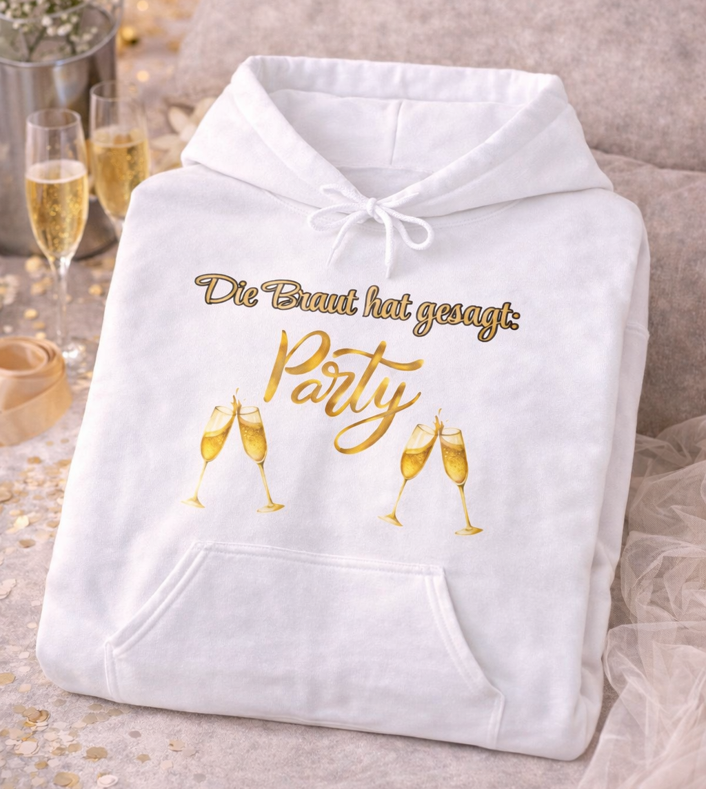 Weißer Unisex-Hoodie mit dem Spruch „Die Braut hat gesagt: Party“ sowie goldenen Champagnergläsern – ideal für den Junggesellinnenabschied und Team Braut.