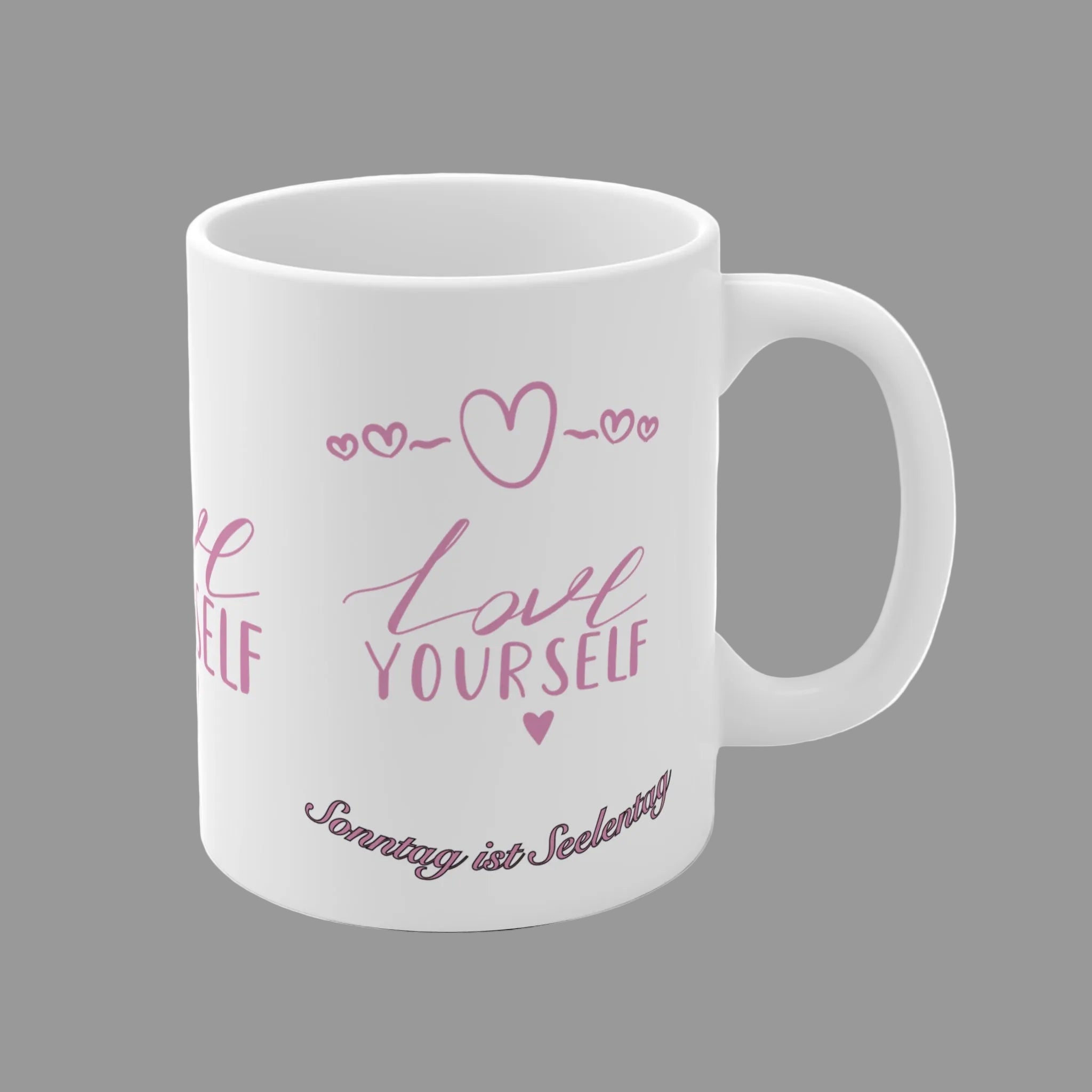 Weiße Keramiktasse mit rosa Schriftzug „Love Yourself“ sowie dem Spruch „Sonntag ist Seelentag“ und kleinen Herzmotiven – 300-ml-Tasse für Kaffee- und Teeliebhaber.